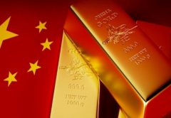 Lingotti d'oro e bandiera cinese